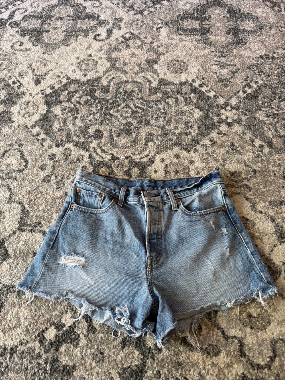 Woman’s Levi Blue Denim Shorts with Distressed Hem